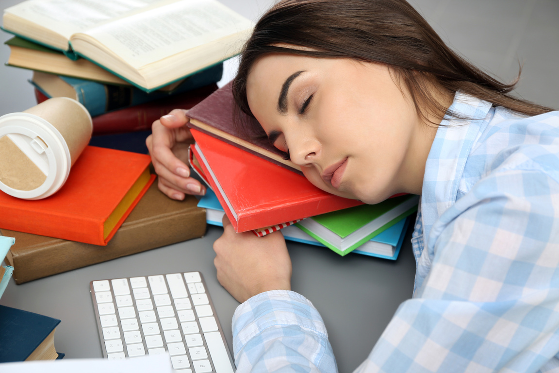 Young Woman Sleeping on Her Books 